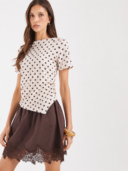 VM Short Sleeve Asymmetric Hem Boatneck Top In Brown Polkadot