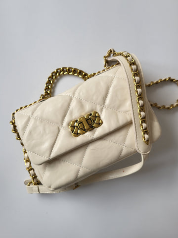 Quilted Gold Chain Crossbody Bag In Cream